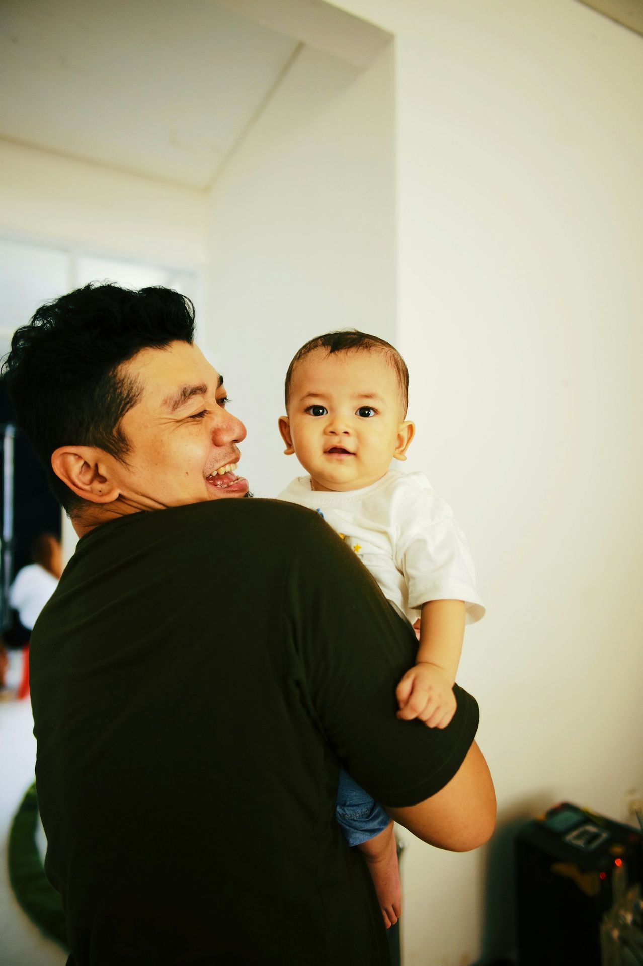 a man holding a baby